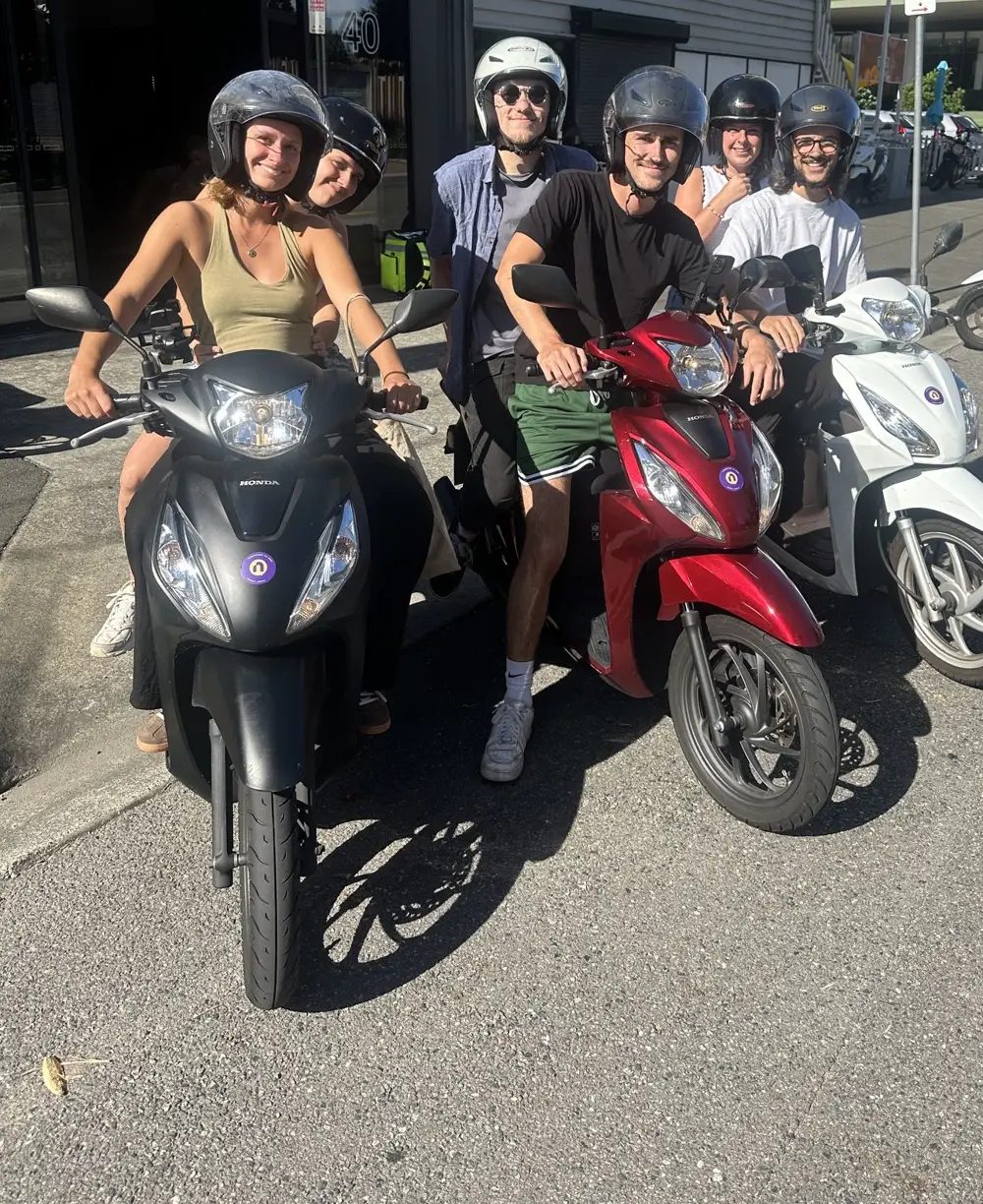 Riders on their scooters outside the Newstead pickup